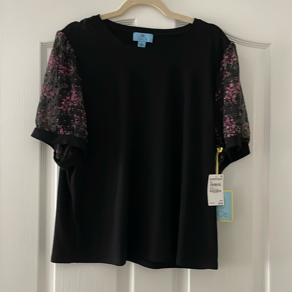 Cute black stretch knit top with sheer sleeves